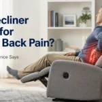 Man sitting in a recliner with lower back pain highlighted, illustrating the question: Is a recliner good for lower back pain?